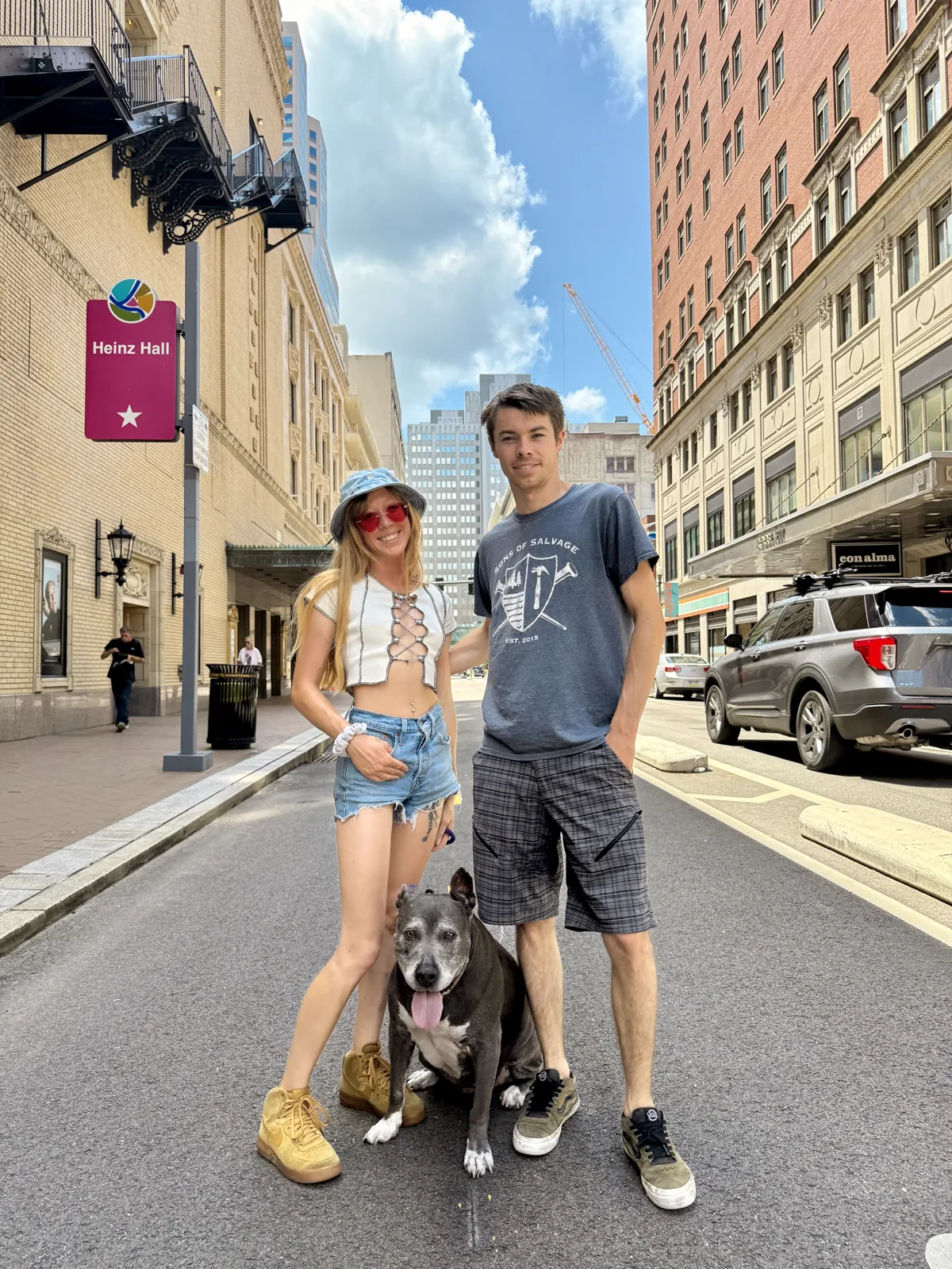 Tate and Hayley walking their dogs in the city